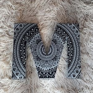 Metal mandala letter M